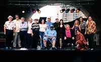 Arches Piano Stage, 2003  l. to r. - Rudy Blue Shoes, Mr. B, unknown, Ricky Nye, Bob Seeley, unknown, Rob Cody, Big Joe Duskin, Phil Lemming, unknown, Ann Rabson, Liz Pennock, unknown, Dr. Blues, Rob Rio 